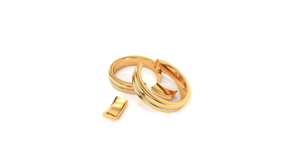 Wedding rings broken, symbolizing broken vows and a broken marriage.
